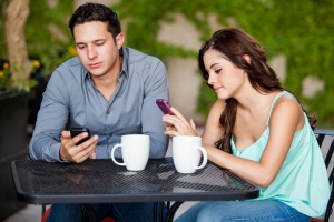 bored-couple-checking-their-phones